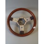 A 1970's Wooden Steering Wheel with Metal Spokes.