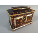 A Tortoiseshell and Mother of Pearl Two Division Tea Caddy on Bun Feet. 19cm Wide.