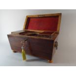 A 19th Century Mahogany Two Division Tea Caddy with Boxwood Stringing and of Sarcophagus Form.