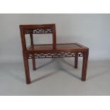 An Oriental Hardwood Two Tier Occasional Table or Stand with Pierced Borders. 72cm Long.