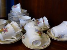 A Part 'Shelly' Hampton Court Tea Set, comprising nine cups, twelve saucers, twelve tea plates,