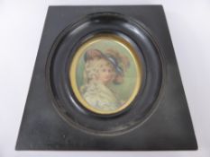 An Antique Portrait Miniature, depicting a young woman, presented in an ebonized frame, label to