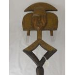A Kota Reliquary Guardian Figure (Mgulu Ngulu), wood decorated with applied metalwork of copper