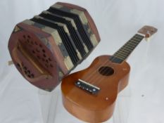 A Ukelele by Positive Music together with a Concertina. (2)