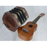 A Ukelele by Positive Music together with a Concertina. (2)
