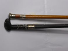 An Ebony Sri Lanka Walking Stick, banded in three sections with silver metal collar together with