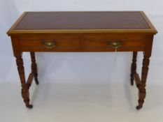 An Edwardian Writing Desk,  two short drawers with swan neck handles and red tooled leather insert