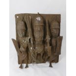 A Benin (West Africa) Plaque, patinated bronze depicting a relief study of three tribal warriors,