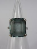 A Lady's 9ct White Gold and Blue Topaz Ring,  Emerald Cut Topaz 16 x 14mm  size O, approx 8.0 gms