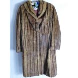 A Lady's Full Length Brown Mink Pelt Coat.