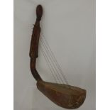 A Warega (Democratic Republic of Congo) Wood and Hide Harp, the pillar of the harp in the form of