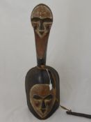 West African Gabonese Vouvi Gong/Bell, the wooden gong carved with heart shaped mask to both body