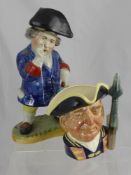 A StaffordshireToby Decanter, depicted standing sniffing snuff wearing yellow breeches, blue jacket,