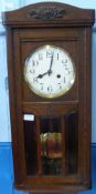 An Oak Cased 3/4 Westminster Wall Clock, with brass and enamel dial, 77 x 32 cms.