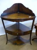 A Georgian Mahogany Corner Wash Stand, two drawers with scalloped shelf, on splayed legs, approx