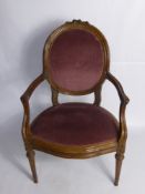 An Antique French 'Louis XV1' Style Salon Chair, with swept arms and decorative carving to the top