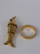 A Lady's 9 ct Gold Hallmark Articulated Fish Pendant, with red stone eyes, approx 4.9 gms,