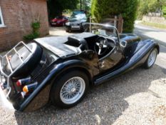 A Black 4/4 Morgan Coupe, 1987 1600cc Low Line, 15 000 miles. The Morgan benefits from black