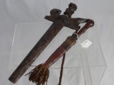 An Antique North African Dagger, the dagger having leather handle and tooled leather scabbard with