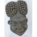 A Substantial Wooden Bamileke (Cameroon) Carving, depicting the head of a warrior, approx 56 cms h