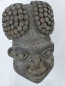 A Substantial Wooden Bamileke (Cameroon) Carving, depicting the head of a warrior, approx 56 cms h