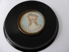 Two Victorian Miniatures, depicting a gentleman and a beautiful lady, both with ebonised frames. (