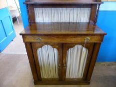 A Victorian Rosewood Chiffonier, with two glaze fronted doors, and a single long drawer with baize