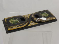 A Victorian Ebonised Book Slide, with gilded decoration and 'Lilly of the Valley' spray with