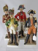 Four German Porcelain Military Figures, depicted in various poses wearing Napoleonic uniform, approx