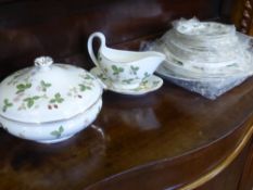 A Part Wedgwood 'Wild Strawberry' Dinner Service, comprising lidded tureen, oval meat plate, three