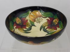 A Moorcroft Nicola Slaney 'Anna Lily' Bowl, factory marks to base, approx 30 x 16 cms