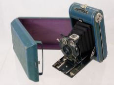 A Green Leather Vest Pocket Kodak Series III, covered folding camera, approx 14 x 8 cms