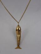 A Continental Yellow Gold Articulated Fish Pendant on Chain, The fish with red stone eyes , approx