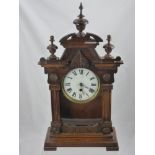 An Oak Cased Wall Clock, with white enamel face and Roman dial, with double mercury pendulum, approx