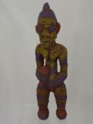 A Bamileke (Cameroon) Ancestral Figure, depicted standing with profuse colourful beading, approx