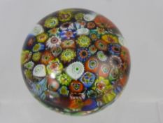 A Vintage Millefiori Paperweight, with multi-coloured canes, approx 8 cms, indistinct signature to