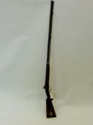 A Colonial 16 Bore Antique Shotgun, walnut stock with semi-pistol grip. Engraved brass trigger