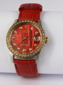 A Lady's Vintage Stainless Steel Rolex Oyster with Diamond Bezel, the watch having a red mother of