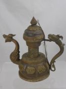 An Antique Indo-Chinese Copper and Brass Coffee Pot, with dragon handle and spout, with Buddhist