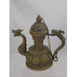 An Antique Indo-Chinese Copper and Brass Coffee Pot, with dragon handle and spout, with Buddhist