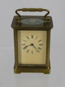 A Brass Cased Carriage Clock, stamped A.C.C. to movement, approx 15 cms