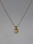 A 9ct White Gold Pearl Pendant, together with a 9 ct yellow gold pearl pendant. (2)