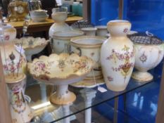 A Quantity of Carlton Blushware, including two pillar vases, two posy vases, hat pin stand, tea