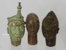 Two West African Benin Bronze Heads, together with a copper example approx 13.5 cms and 19 cms (3)