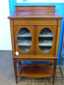 An Antique Mahogany Music Cabinet, oval glazed fronted door, the cabinet has three internal