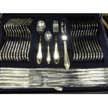 A 12 Piece Stainless Steel Cutlery Set, stamped 22 gold plated, together with a case of supper