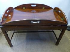 An Antique Mahogany Butler's Tray, having panelled top with carry handles to all sides, with
