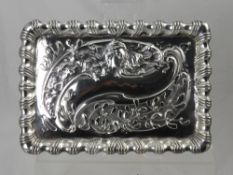 A Silver Rectangular Serving Tray, embossed in shallow relief, Birmingham hallmark, dated 1907/08,