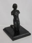 A Bronze Figurine, Art Deco Style, depicting a 'Kneeling Girl', supported on a square plinth, approx