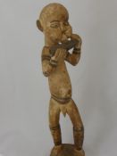 A Ghananian Carving of a Keta Flute Player, approx 63 cms together with an Ashanti Fertility